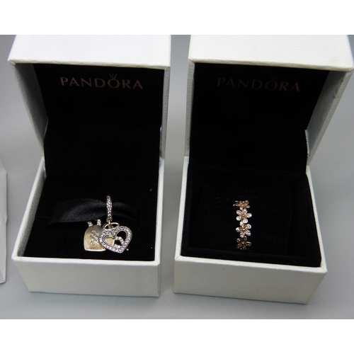 867 - Three Pandora charms including one Disney and a Pandora ring