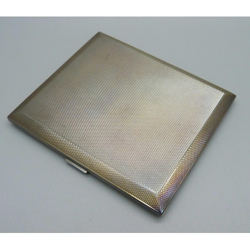 880 - An engine turned silver cigarette case, 141g, 82mm x 95mm