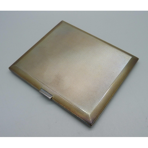 880 - An engine turned silver cigarette case, 141g, 82mm x 95mm