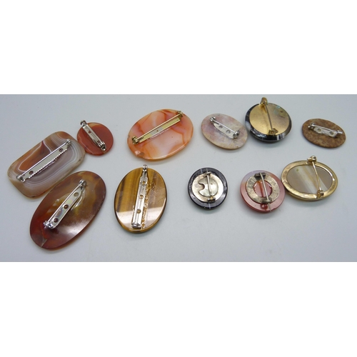 895 - Eleven agate brooches, two chipped