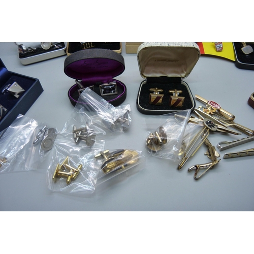 924 - A collection of cufflinks, tie-pins and clips