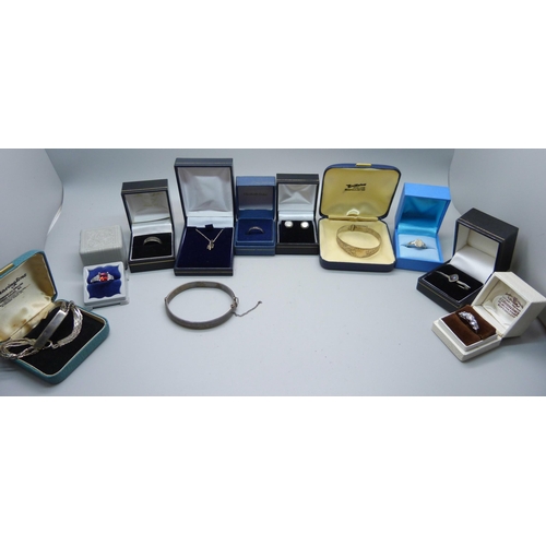 925 - Silver items including two bangles, a bracelet, five rings, brooch, earrings and pendant