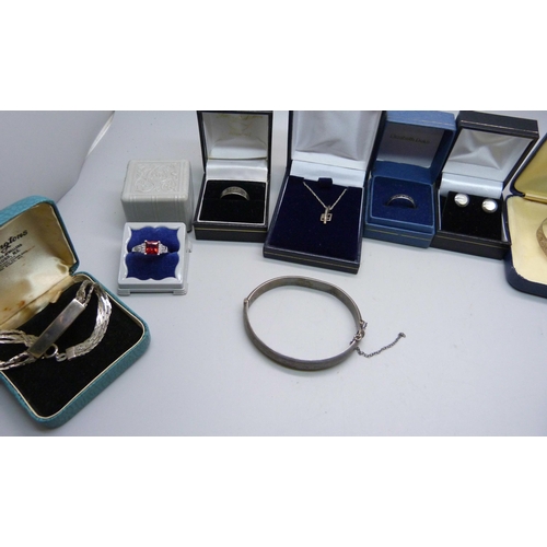 925 - Silver items including two bangles, a bracelet, five rings, brooch, earrings and pendant