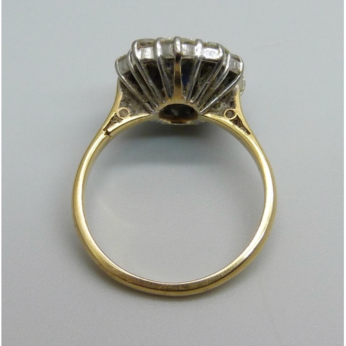 940 - An 18ct gold, sapphire and diamond cluster ring, 4.9g, O, approximately 1ct total diamond weight