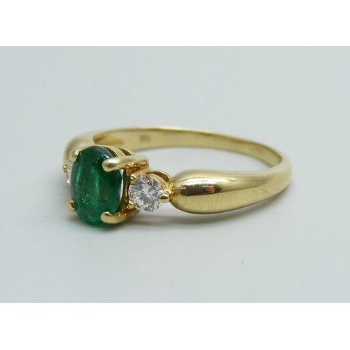 942 - A yellow metal, emerald and diamond ring, 3.3g, M, hallmark work