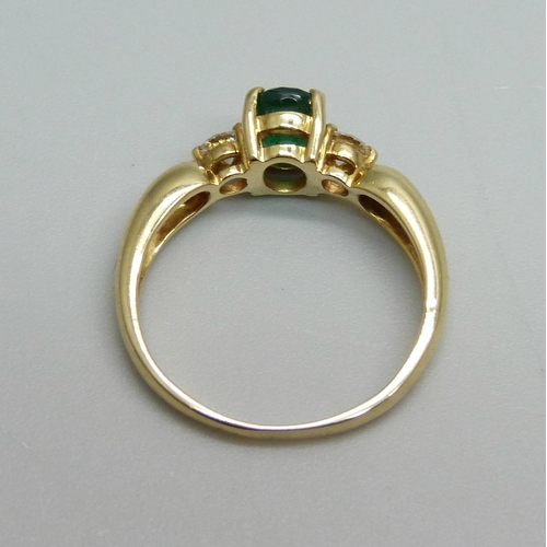 942 - A yellow metal, emerald and diamond ring, 3.3g, M, hallmark work