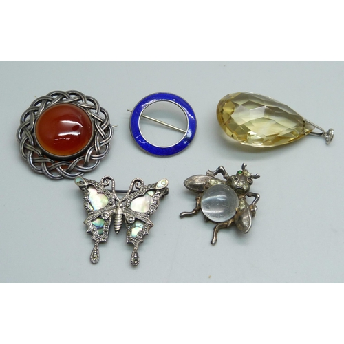 945 - A Scottish silver Iona brooch, a silver Trifari insect brooch, two other brooches and a pendant, (in... 