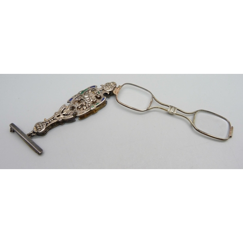 956 - A pair of decorative enamelled lorgnettes suspended on a silver bar brooch, enamel a/f