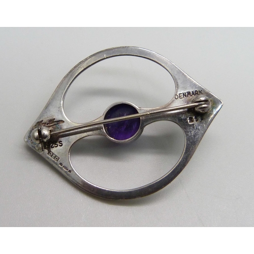 961 - A Danish Arne Johansen 211 brooch with Hans Hansen signature, set with a cabochon amethyst, London i... 