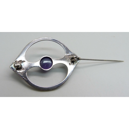 961 - A Danish Arne Johansen 211 brooch with Hans Hansen signature, set with a cabochon amethyst, London i... 