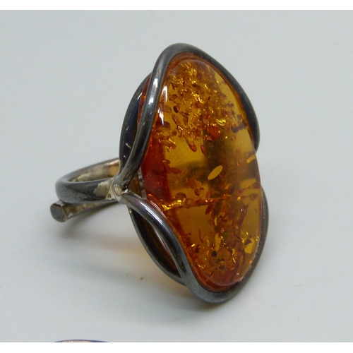 967 - A silver and amber cocktail ring, K/L, and a silver and amber bracelet