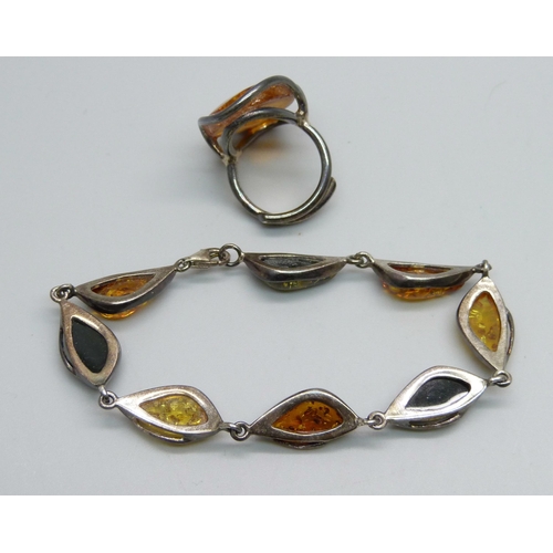 967 - A silver and amber cocktail ring, K/L, and a silver and amber bracelet