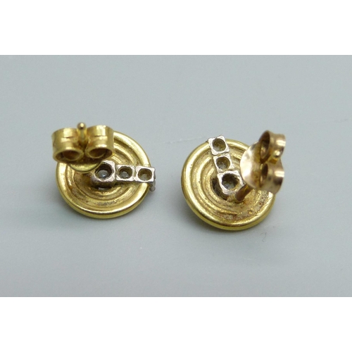 973 - A pair of 18ct gold and diamond set stud earrings, 2.5g