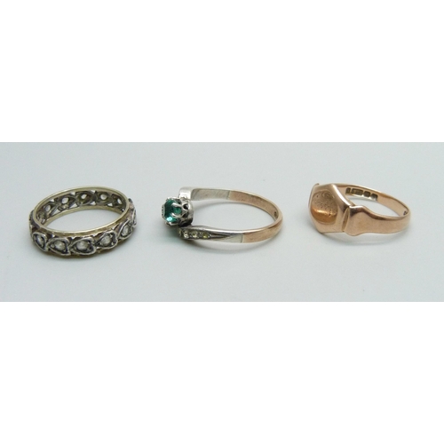 983 - A 9ct gold ring, 2.4g, L, and two 9ct gold and silver rings, 4.8g, K and M