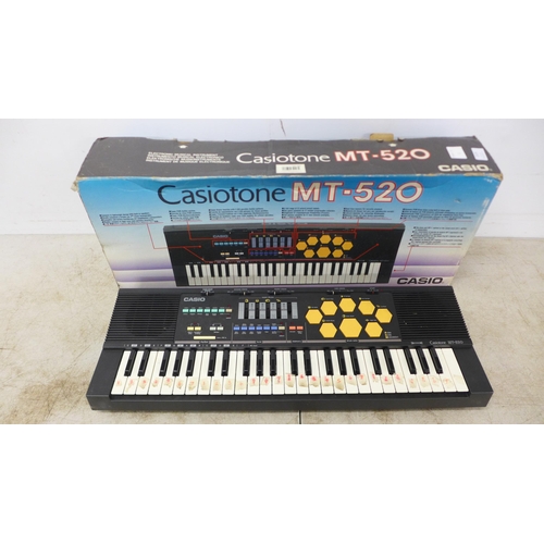 2129 - A Casio Casiotone MT-520 electric keyboard with drum FX pad - boxed