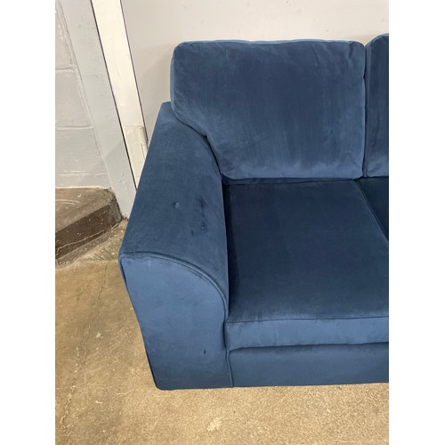 1503 - A blue velvet corner sofa - slight damage