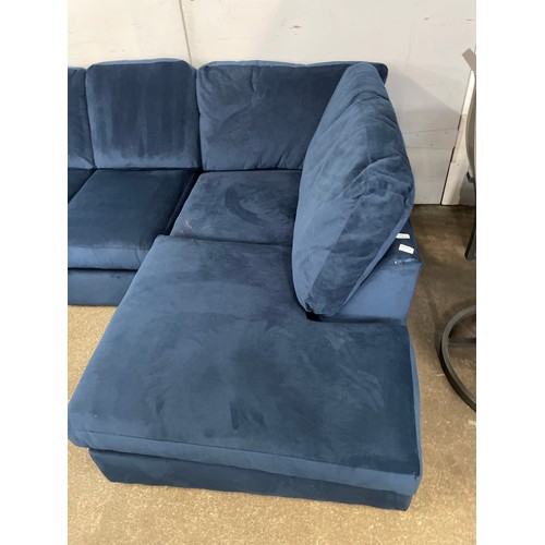 1503 - A blue velvet corner sofa - slight damage