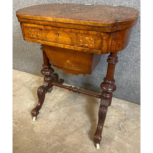 136 - A Victorian inlaid walnut lady's sewing/games table