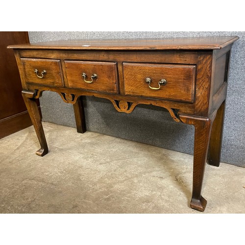 182 - A George II style oak three drawer dresser