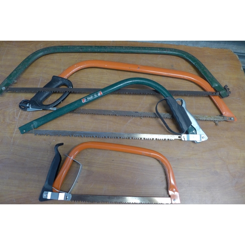 2295 - A quantity of garden tools including- bow saws, hose pipe, hedge cutters, kneel stool and a tool tro... 