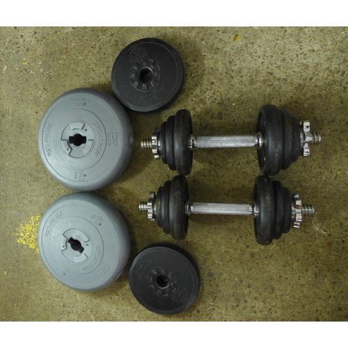 2303 - A pair of dumbbells and 16 weight plates - various sizes and weights