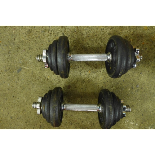 2303 - A pair of dumbbells and 16 weight plates - various sizes and weights