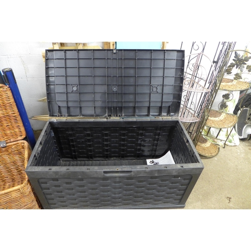 2329 - A Keter style garden storage box and a large wicker basket