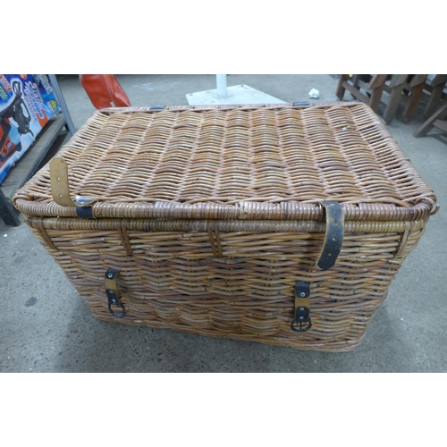 2329 - A Keter style garden storage box and a large wicker basket