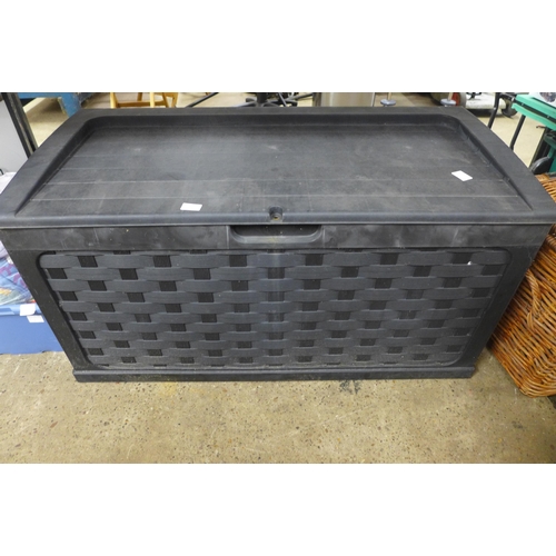 2329 - A Keter style garden storage box and a large wicker basket