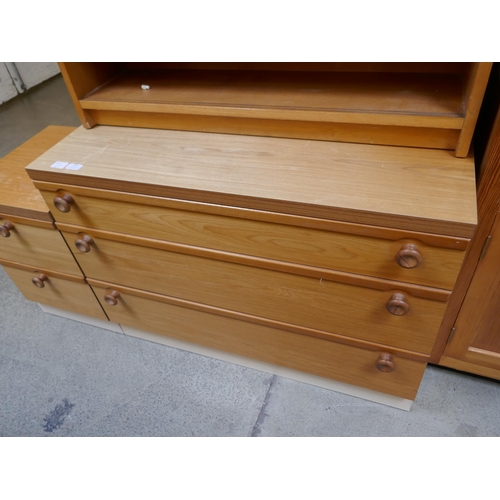 1560 - A bookcase, chest of drawers and bedside chest