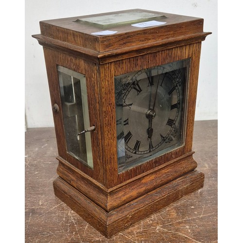 371 - A late 19th Century oak single fusee mantle clock