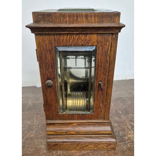 371 - A late 19th Century oak single fusee mantle clock