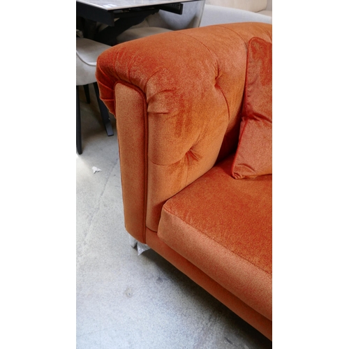 1522 - A tangerine velvet buttoned three seater sofa