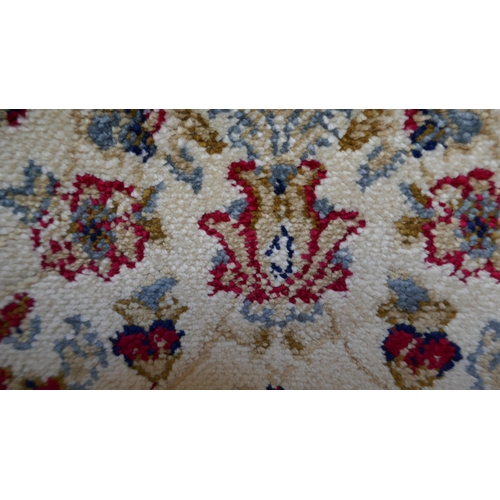 1526 - An ivory ground full pile cashmere runner, all over floral pattern, 240 x 70cm