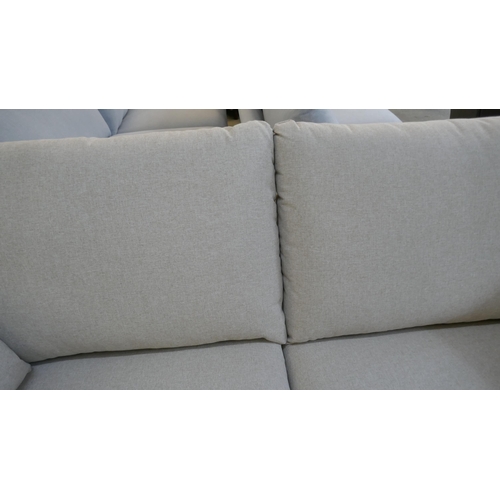 1529 - A linen upholstered three seater sofa RRP £1349