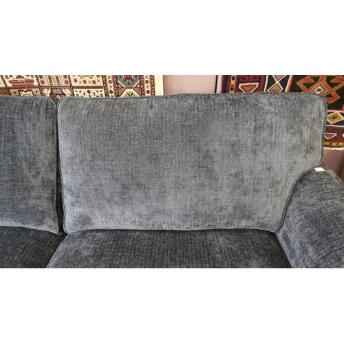 1531 - A deep blue upholstered three seater sofa