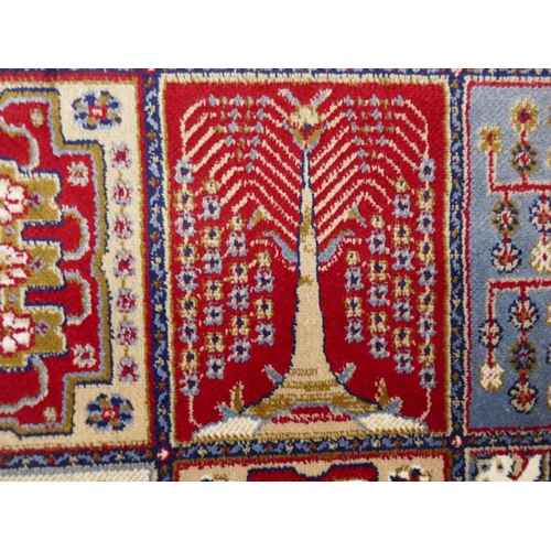 1532 - A large full pile cashmere carpet, traditional Persian panel design, 380cm x 280cm