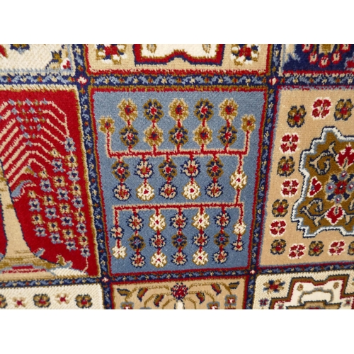 1532 - A large full pile cashmere carpet, traditional Persian panel design, 380cm x 280cm