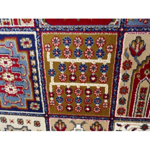 1532 - A large full pile cashmere carpet, traditional Persian panel design, 380cm x 280cm