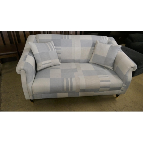 1537 - A blue patterned two seater sofa