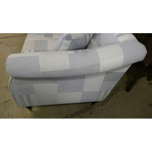 1537 - A blue patterned two seater sofa