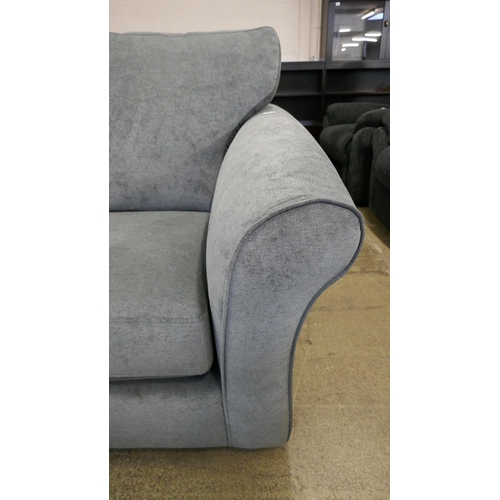 1538 - A pewter upholstered corner sofa