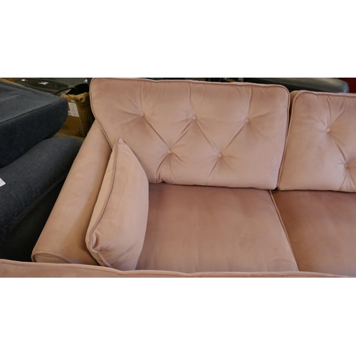 1555 - A pair of pink velvet Hoxton three seater sofas