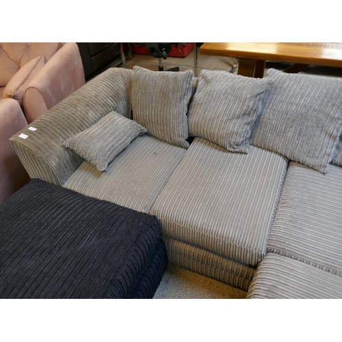1556 - A grey cord corner sofa and a black footstool