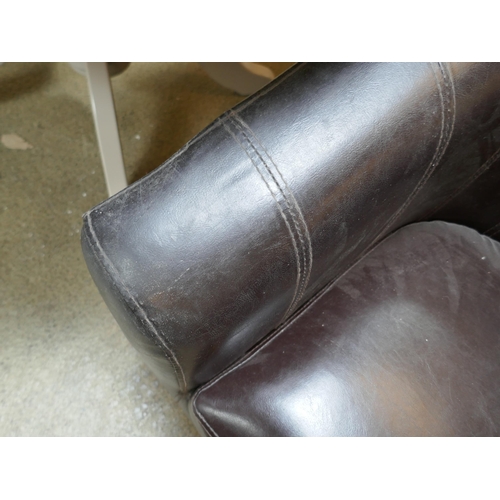 1567 - A pair of brown leather effect tub chairs