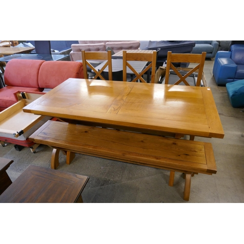 1572 - An oak dining table, three chairs and a bench