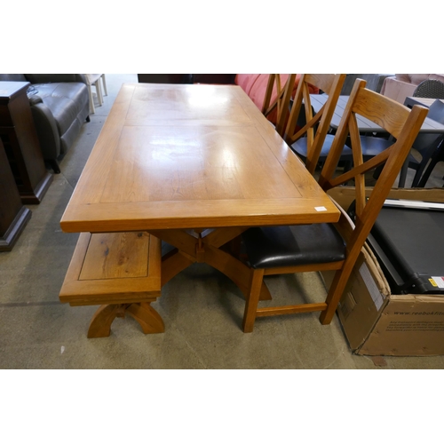 1572 - An oak dining table, three chairs and a bench