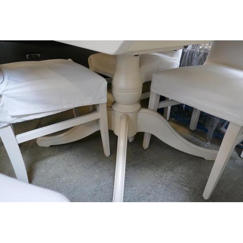 1600 - An off white extending dining table and four chairs