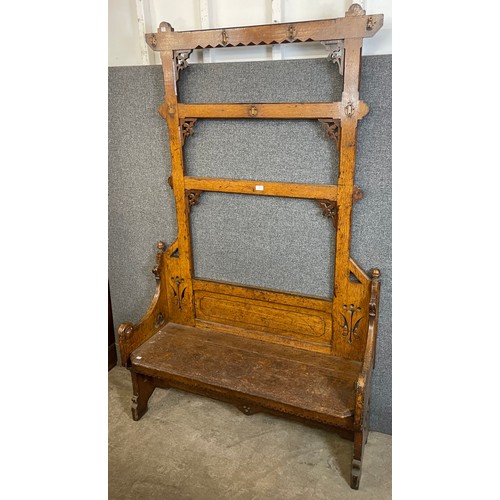 142 - A Victorian Aesthetic Movement carved oak hallstand