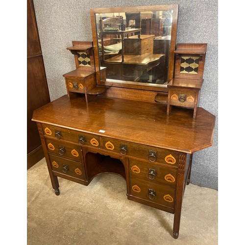 149 - A Liberty & Co. style Arts and Crafts inlaid oak dressing table